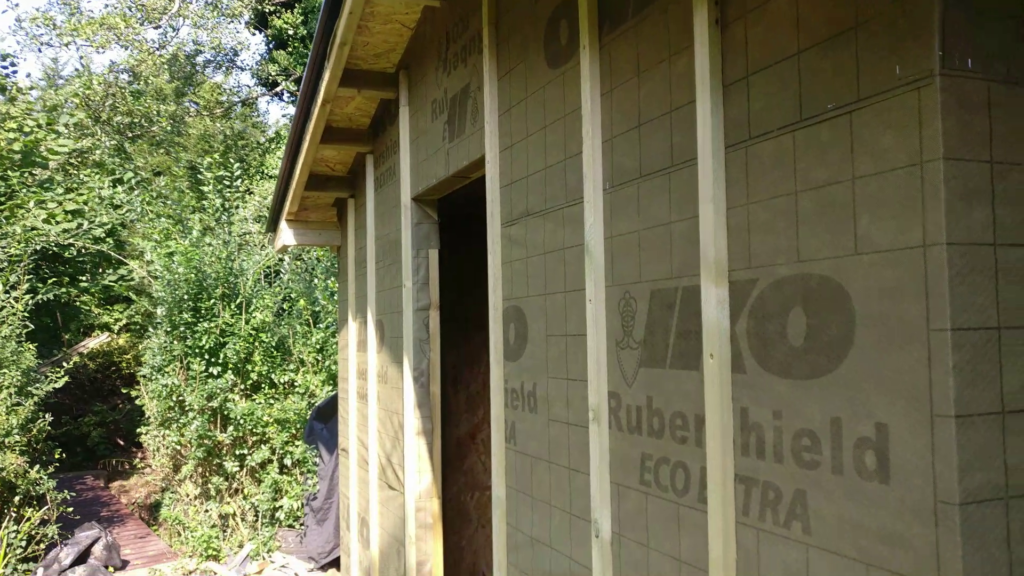 Vertical timber counter-battens installed over breathable wall membrane for shed cladding ventilation